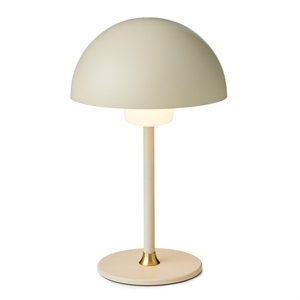 Bordlampe med kuppelformet skærm i creme, guld accent ved base, 35 cm høj, 12,5 cm i diameter.